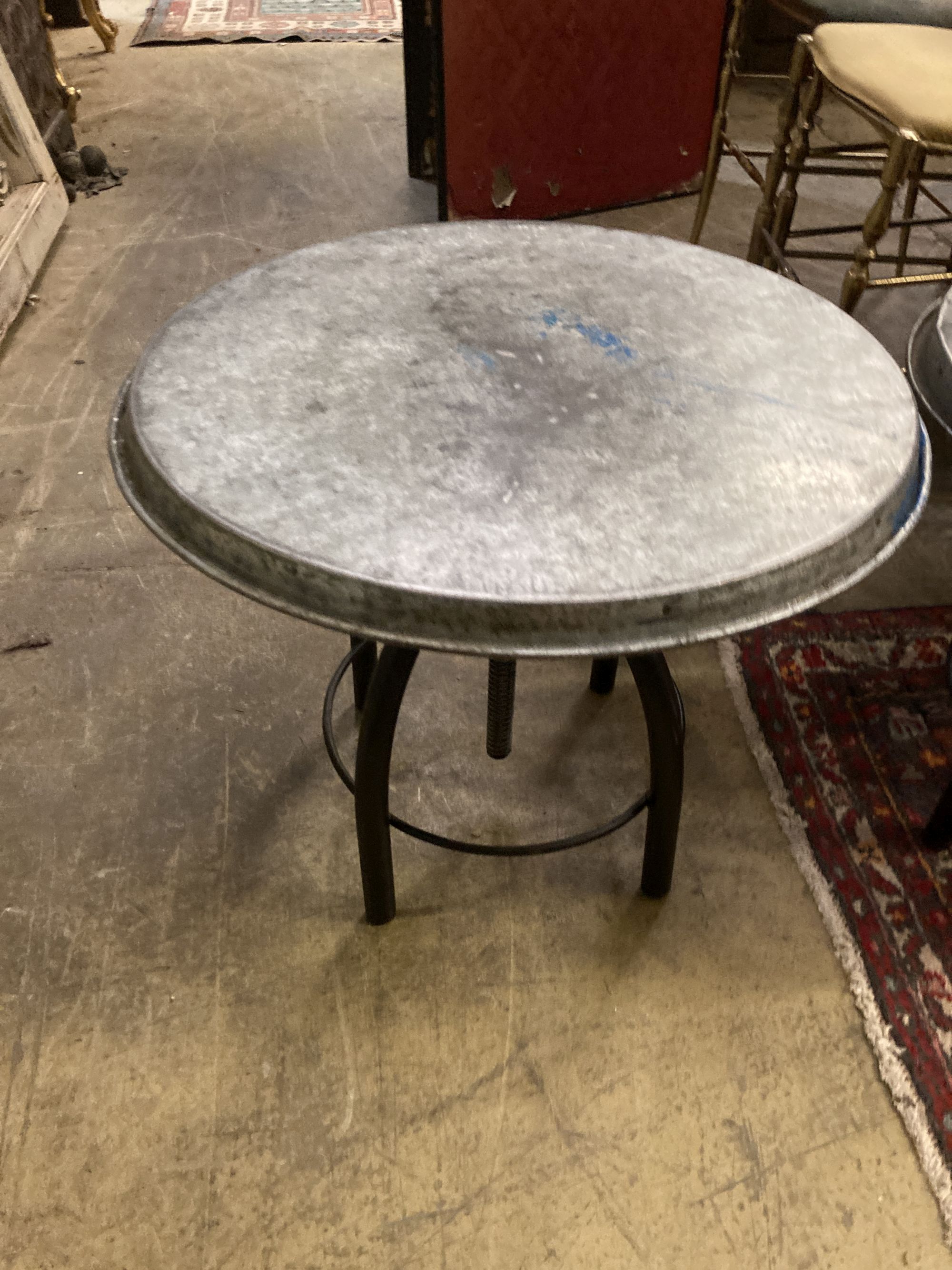 Two industrial style circular metal occasional tables, 54cm diameter, height 44cm